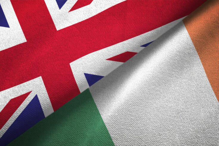 Ireland and UK flag together real textile cloth fabric texture