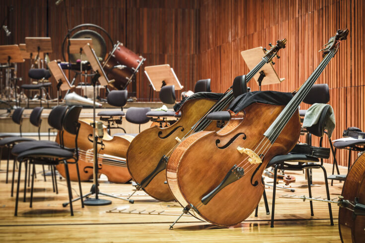 Cello music instruments on a stage.