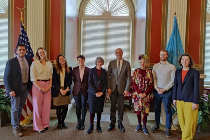 A group of Library of Congress staff and International Placement Scheme Fellows pose for a photo with Dame Ottoline Leyser on her visit to the Library.
