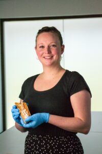 Dr Rebecca Shepherd, the lead researcher on the project holding, a sample of mammoth ivory.