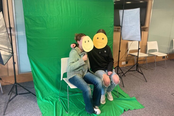 Young people in front of a green screen making a film about the pressures of teenage life in Falmouth