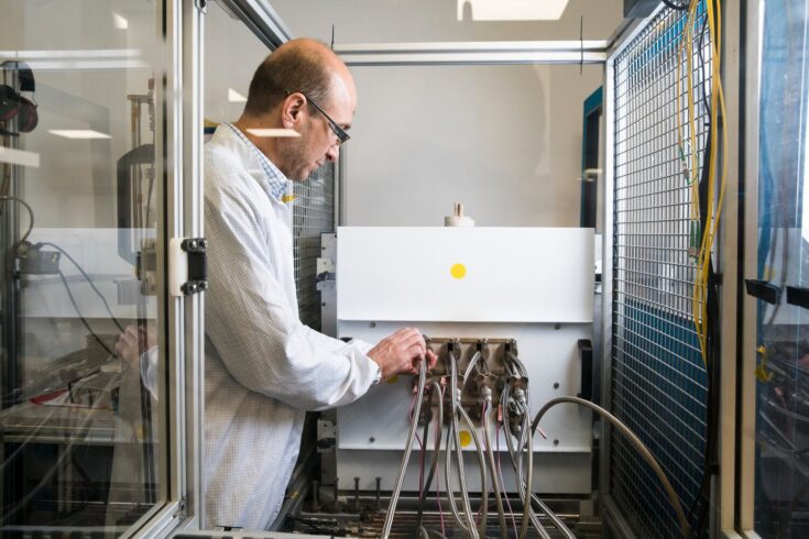 Engineer prepares equipment at Oxsensis' facility