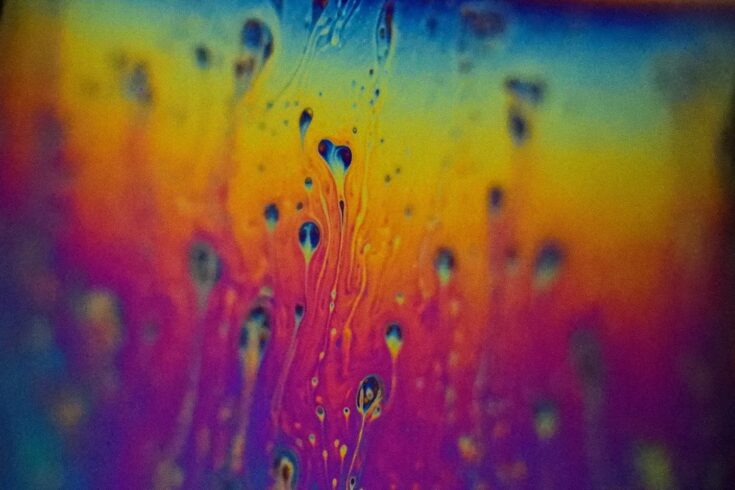 Turbulent flow within the draining of a thin soap film. Colours arise from interference within the thin film indicating differences in thickness.