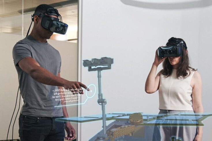 Two people wearing Ultraleap's virtual reality headsets