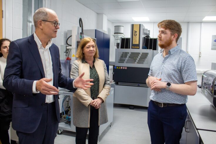Sir Patrick Vallance and Professor Julie Fitzpatrick talking to a researcher, November 2022