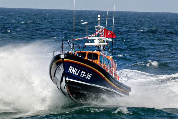 Royal National Lifeboat Institution speedboat racing across the sea