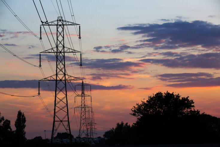 L2 electricity pylons at sunset in Somerset, England, UK.