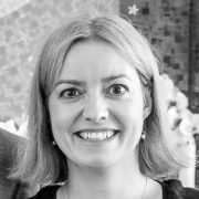 Black and white headshot of Jo Latimer smiling