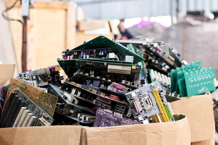 Cardboard box full of old computer parts