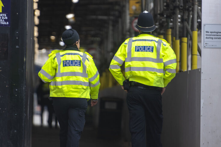 Two police officers on patrol in Birmingham city centre, UK