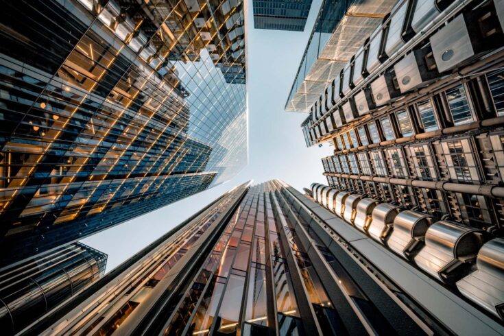 Looking directly up at the skyline of the financial district in central London