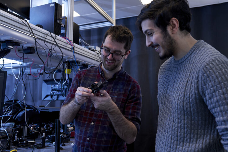 Two people in an electronics lab