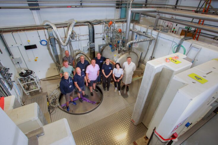 Members of the Daresbury Laboratory cavity test team standing in the test bunker facility.