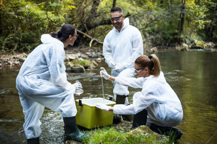Young scientists take water samples from the mountain river.