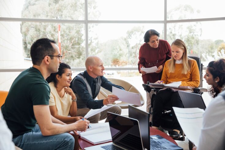 A group of scientists in mid discussion