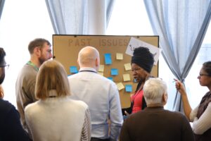 Healthcare professionals, researchers, commissioners and Community members exploring what equitable partnership in health research means for South East London at a 2023 event run by Mabadiliko.