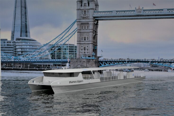 Thames Clipper passing under Tower Bridge London