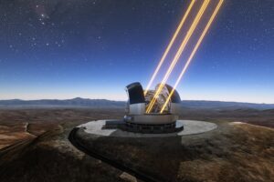 Artist’s rendering shows the Extremely Large Telescope in operation on Cerro Armazones in northern Chile. The telescope is shown using lasers to create artificial stars high in the atmosphere.