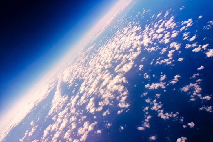 A view of Earth from above, with cloud patterns visible.