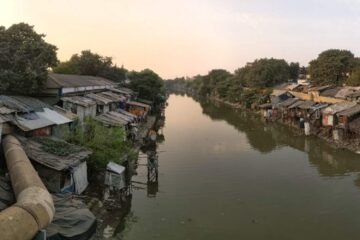 Urban wastewater channels flowing into the river.