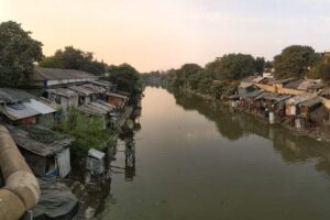 Urban wastewater channels flowing into the river.