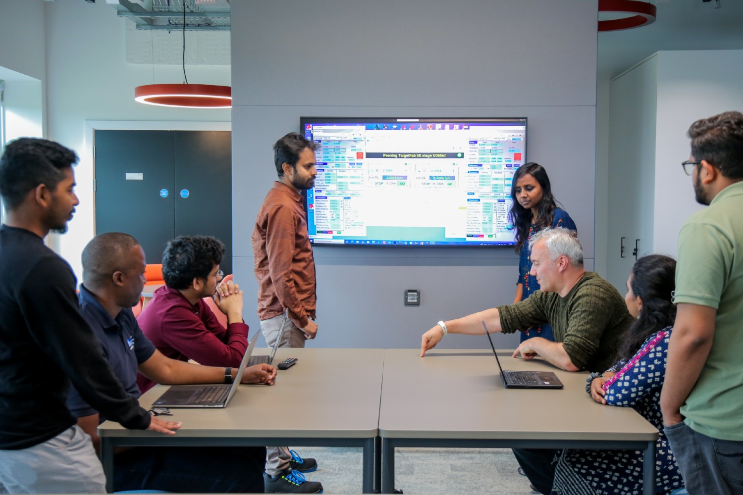 Group of engineers sitting at a table.