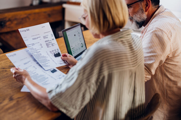 Couple looking at an energy bill.