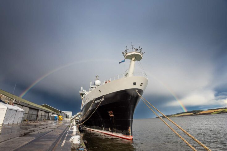 RSS Discovery ship secured to a dock.
