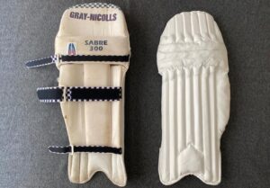 A pair of batting pads where Piñatex leather substitutes existing PU leather, recovered internal padding and repair of Velcro straps.