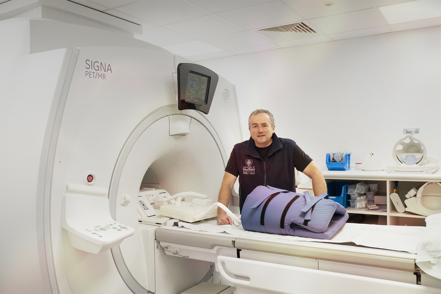 A researcher with an MRI scanner.