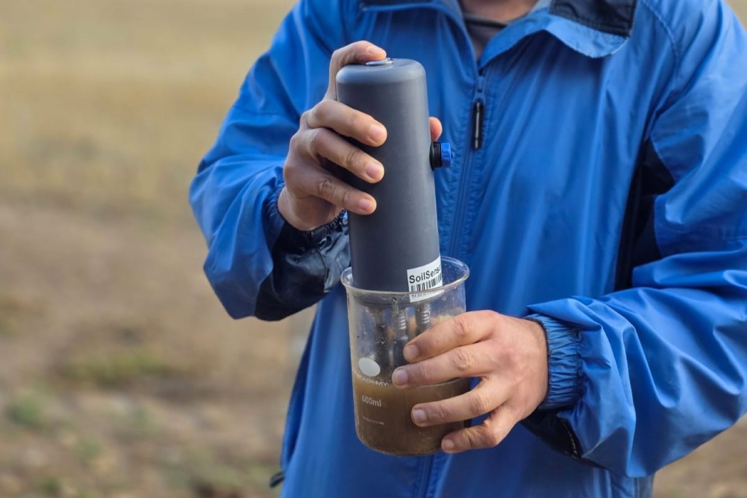 Dr Aleksander Radu using the new soil nutrient sensor, Agristat, to measure soil nitrate and ammonium content.