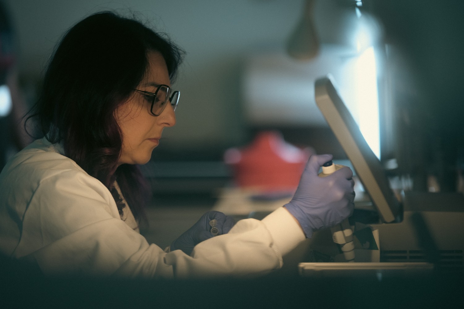 A Trogenix scientist using a pipette