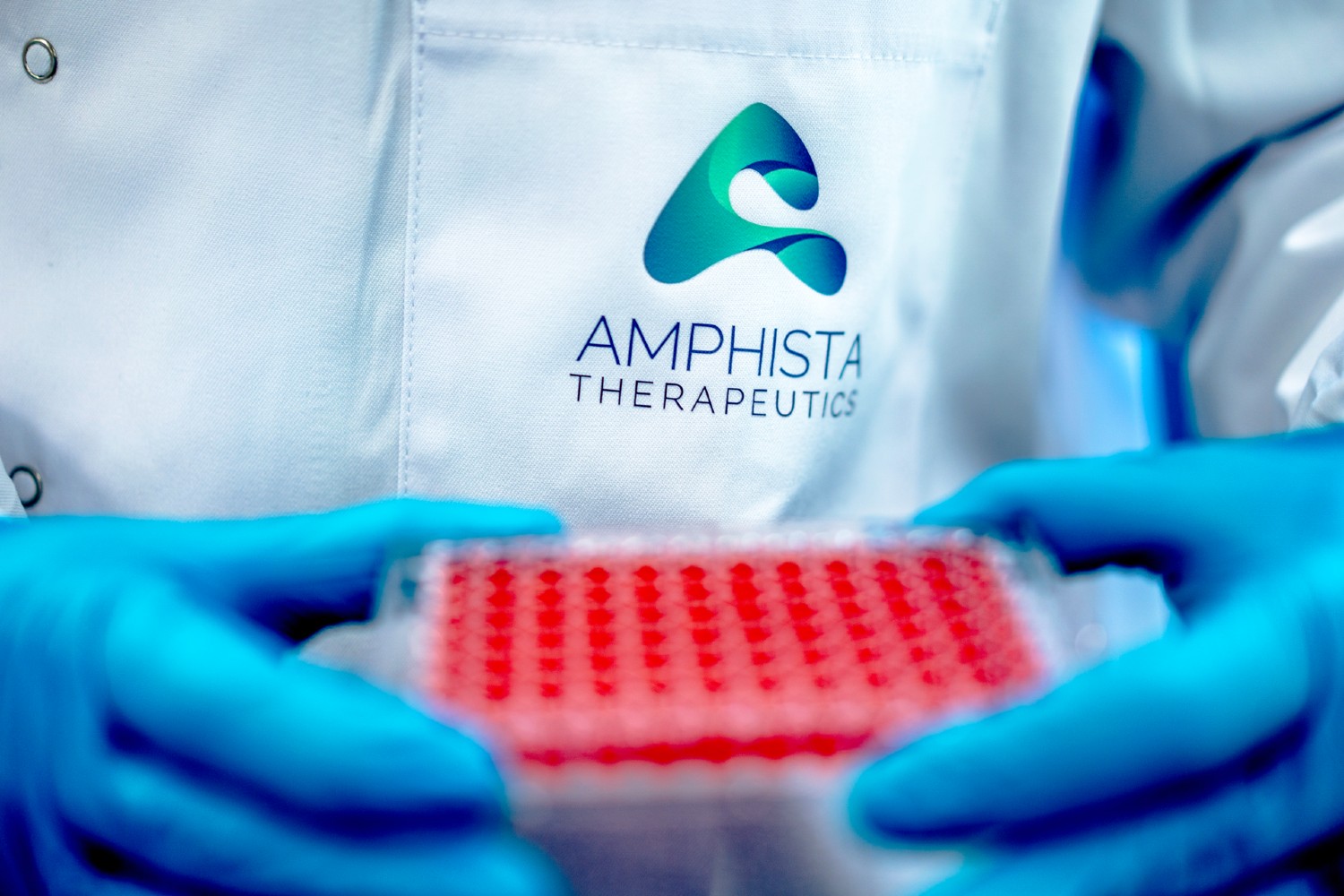 An Amphista Therapeutics scientist carrying samples