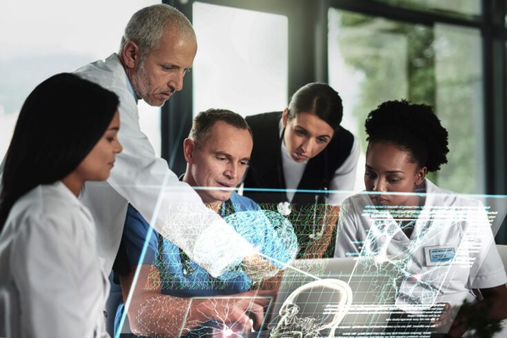 group of scientists working together on a shared screen