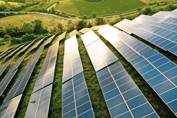 Solar panels in a green field